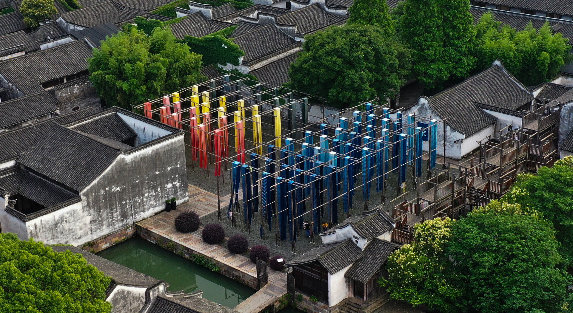 Colourful cloth hanging at wuzhen grass dye mill.