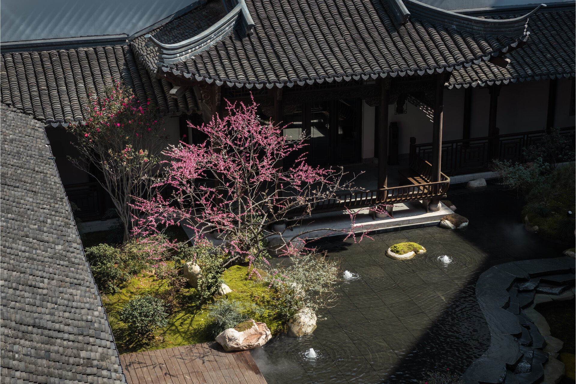 The internal courtyard features a dry landscape with no water features.