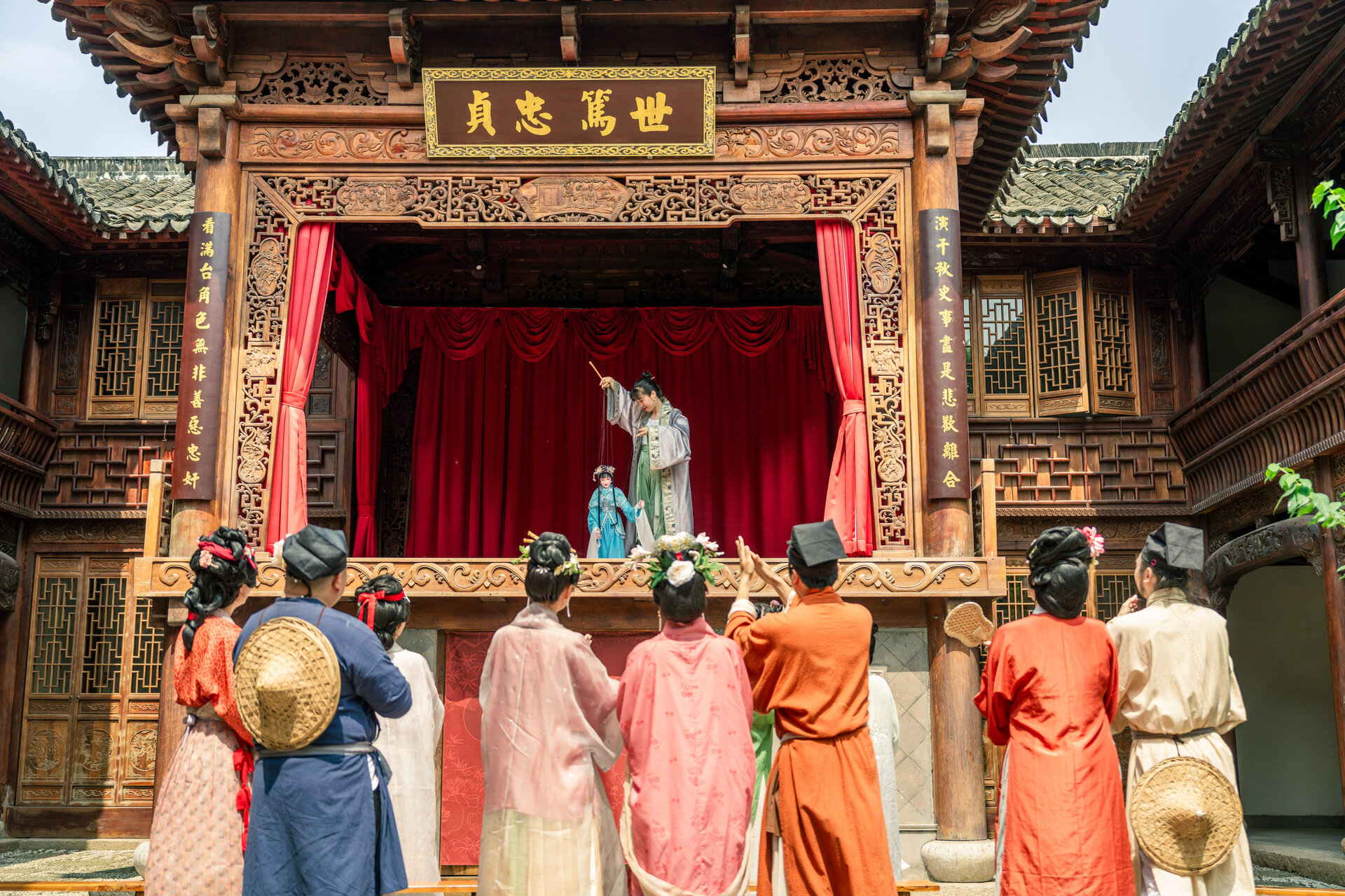 Traditional Chinese hand puppet performance on the historic wooden stage in Puyuan.