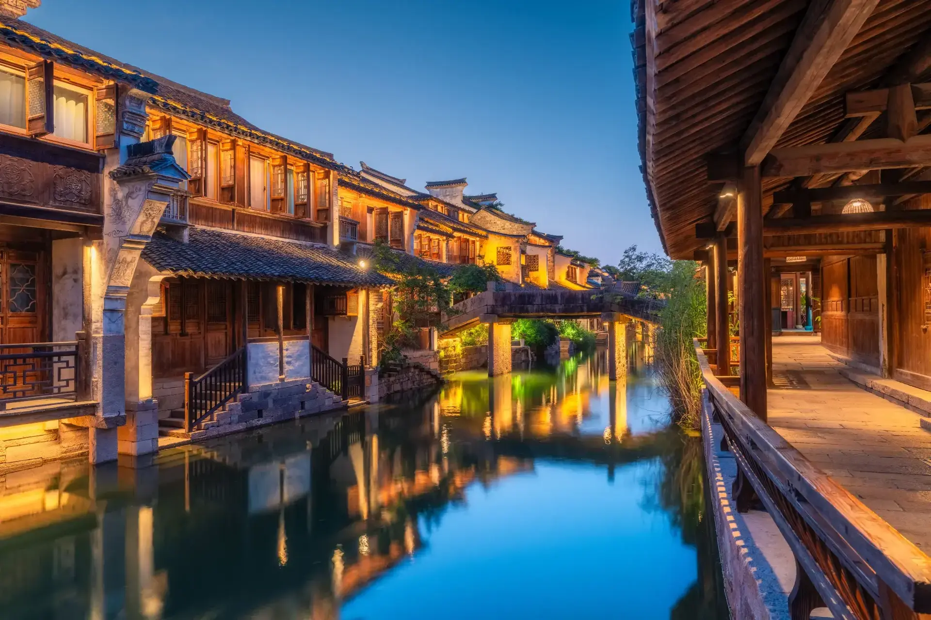 Wooden covered walkway along Puyuan canal at night