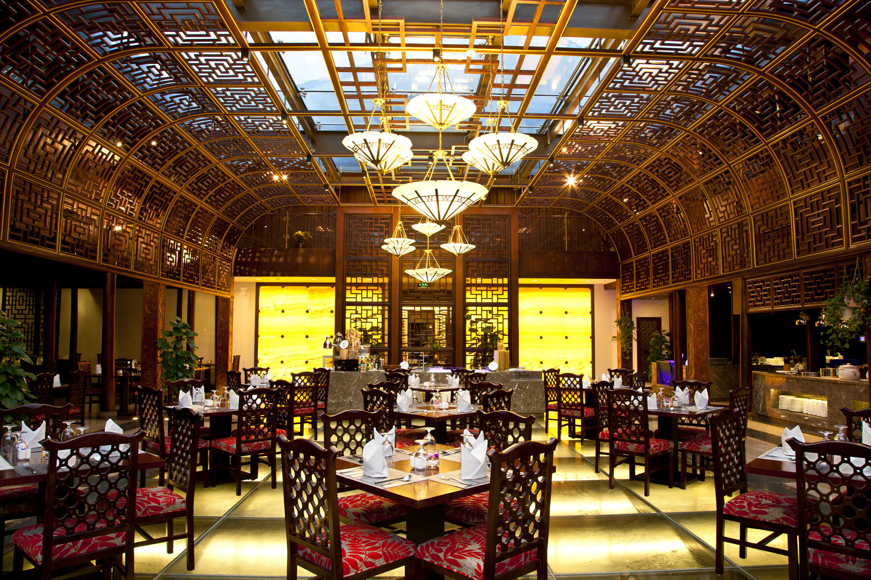 The interior setting of the Water-Sky western restaurant with elegant tables and chairs.