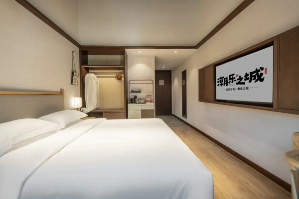 Interior of a double room with minimal decor and soft lighting.