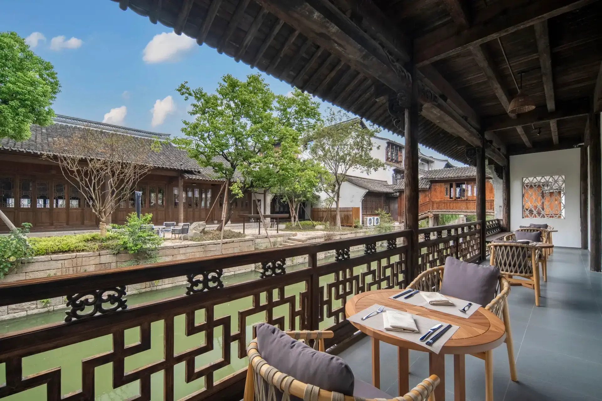 Wooden dining veranda overlooking Yanguan water canal.