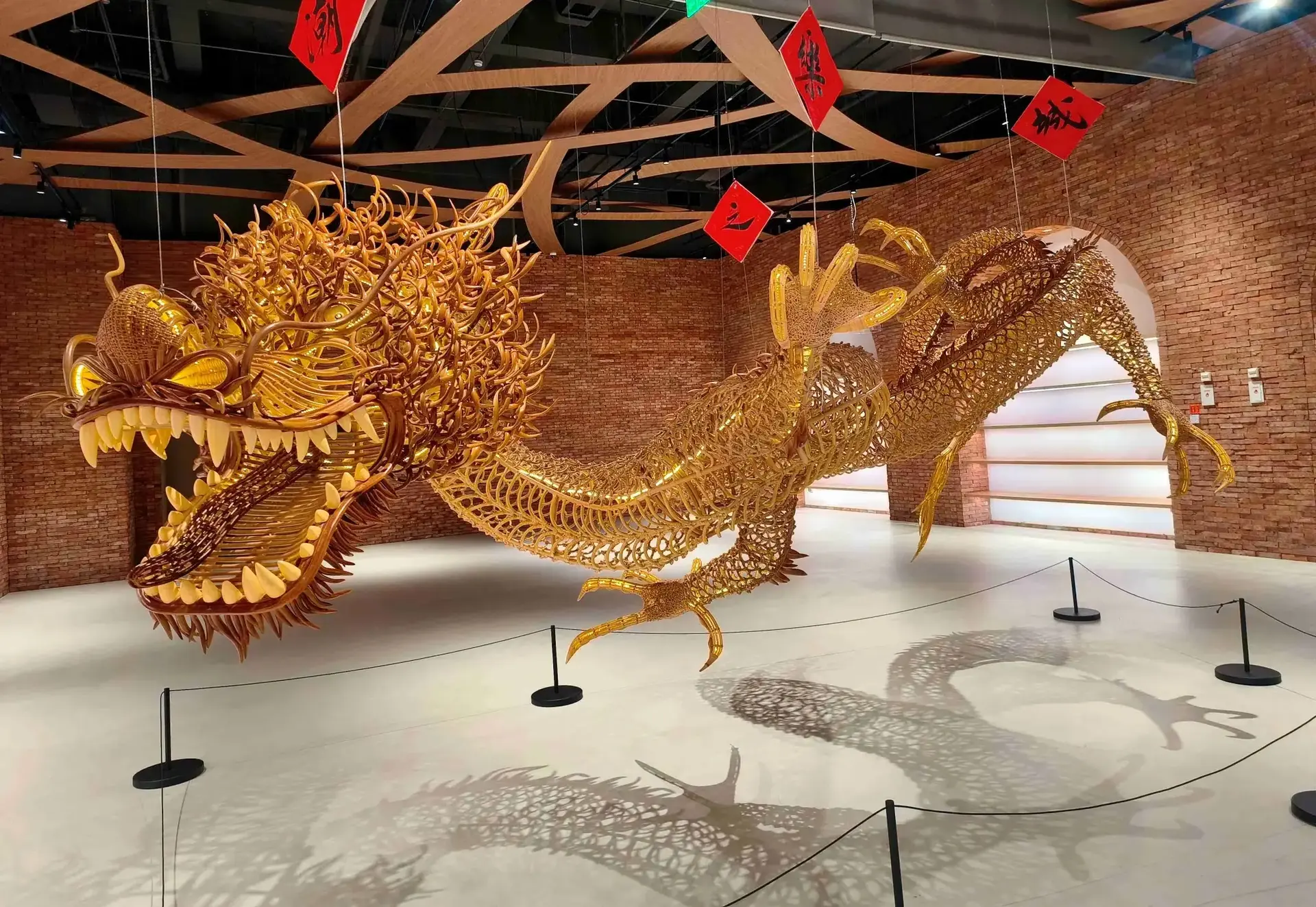 Hollow bamboo dragon sculpture in Tide Music City exhibition hall.