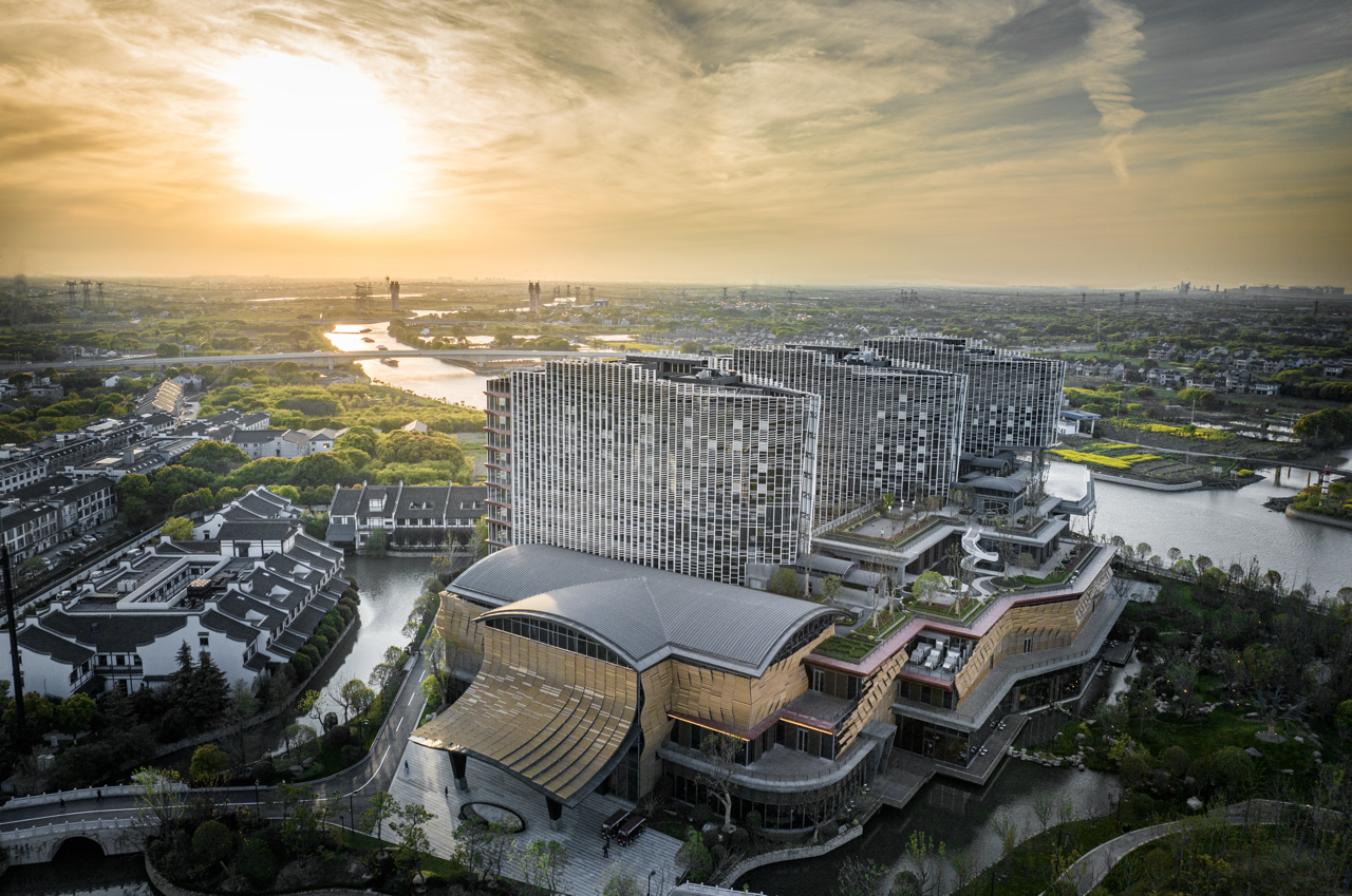 Exterior of a contemporary resort hotel integrated with natural landscape.