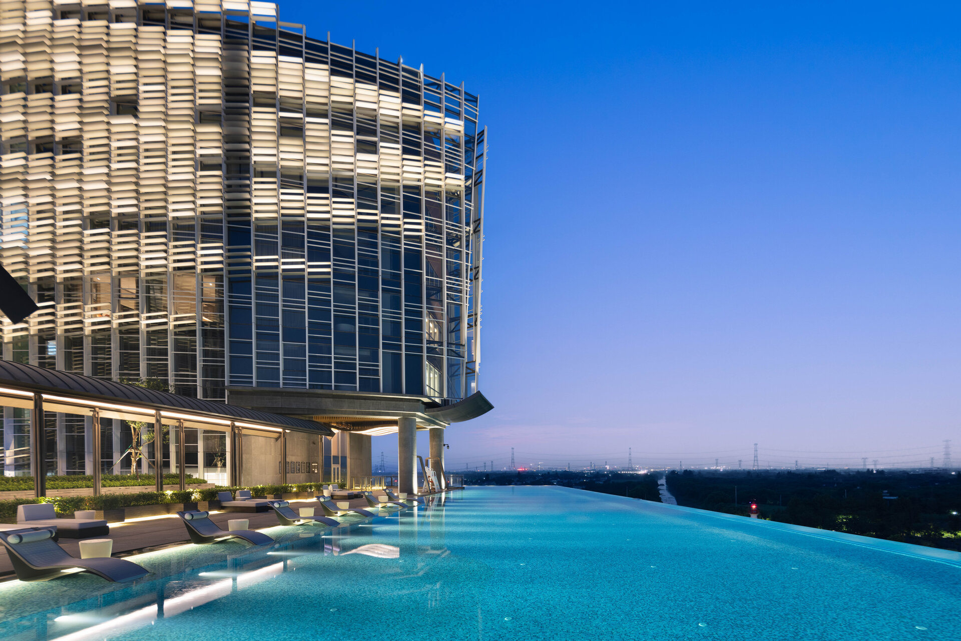 The outdoor sky infinity pool overlooking the city skyline.