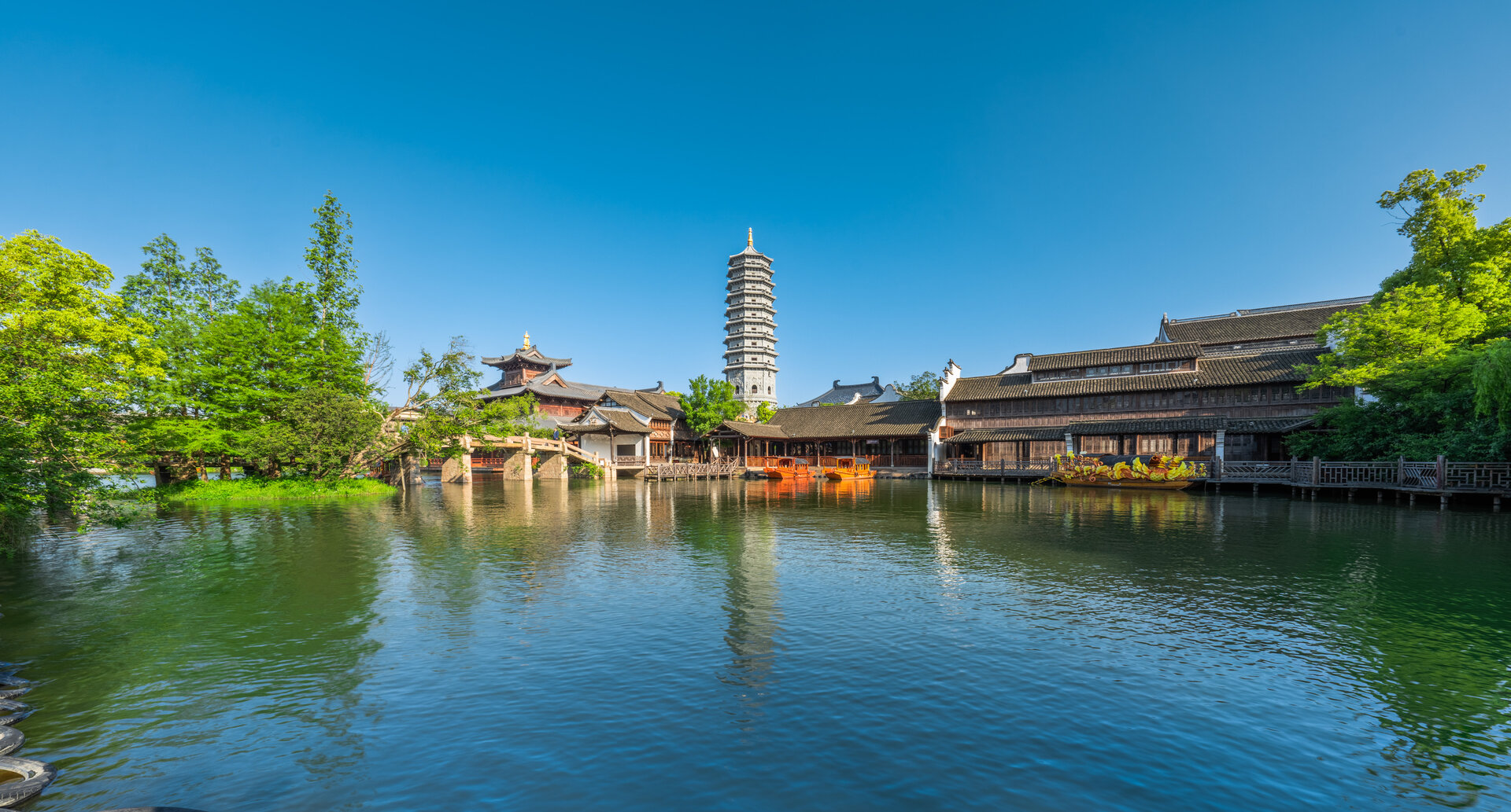 Clear-day panorama of Puyuan ancient town pagoda by canal.