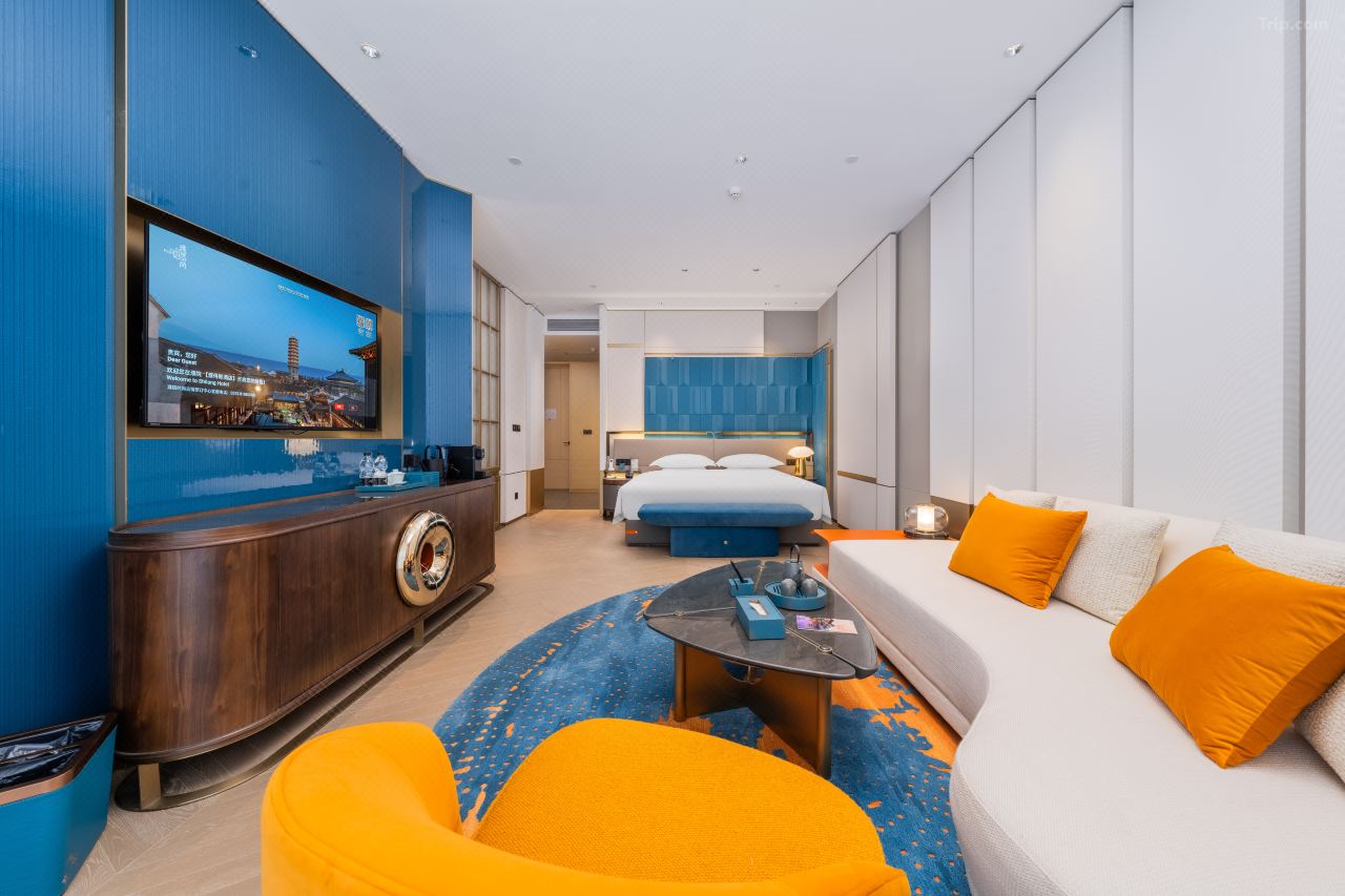 Interior of a deluxe courtyard double room with large bed.