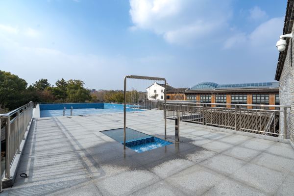 Outdoor pool with panoramic water town views.