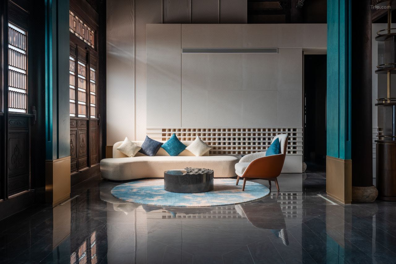 Contemporary public lounge area with river-facing windows.