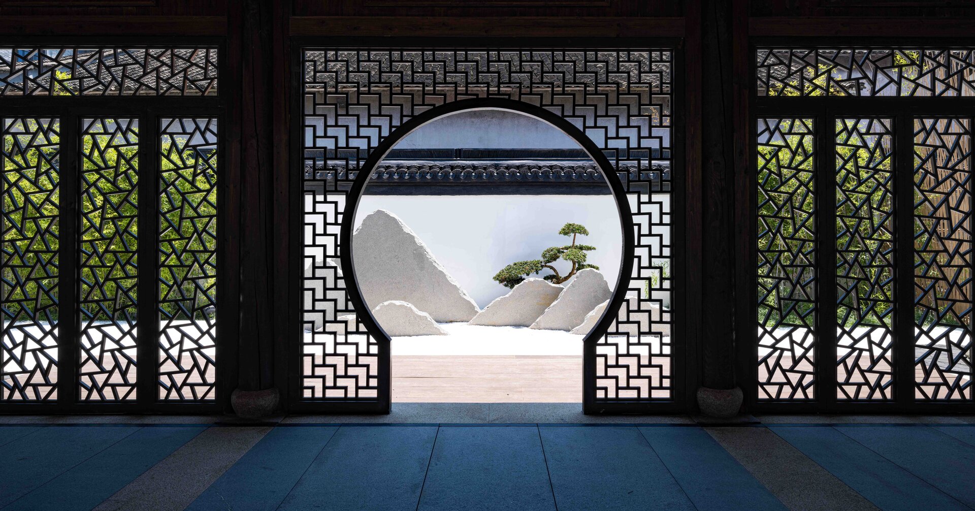 Interior view featuring a decorative door frame and a rockery.