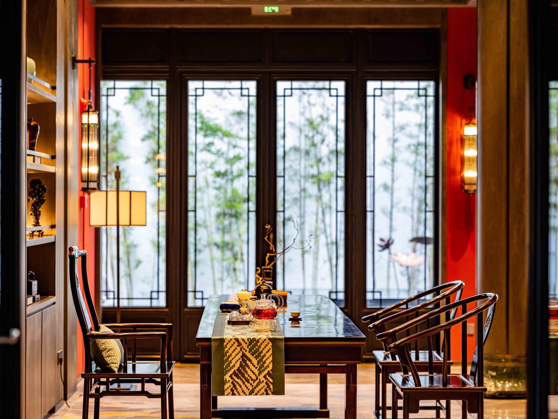 Lobby bar seating area by the window with a small table.