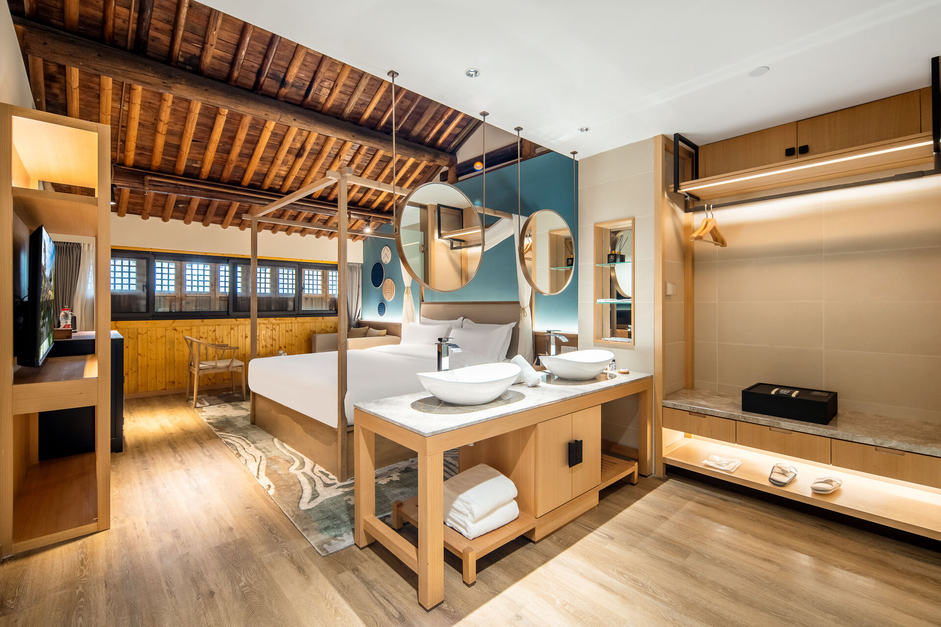 Interior of a deluxe waterside double room with canal-facing window.