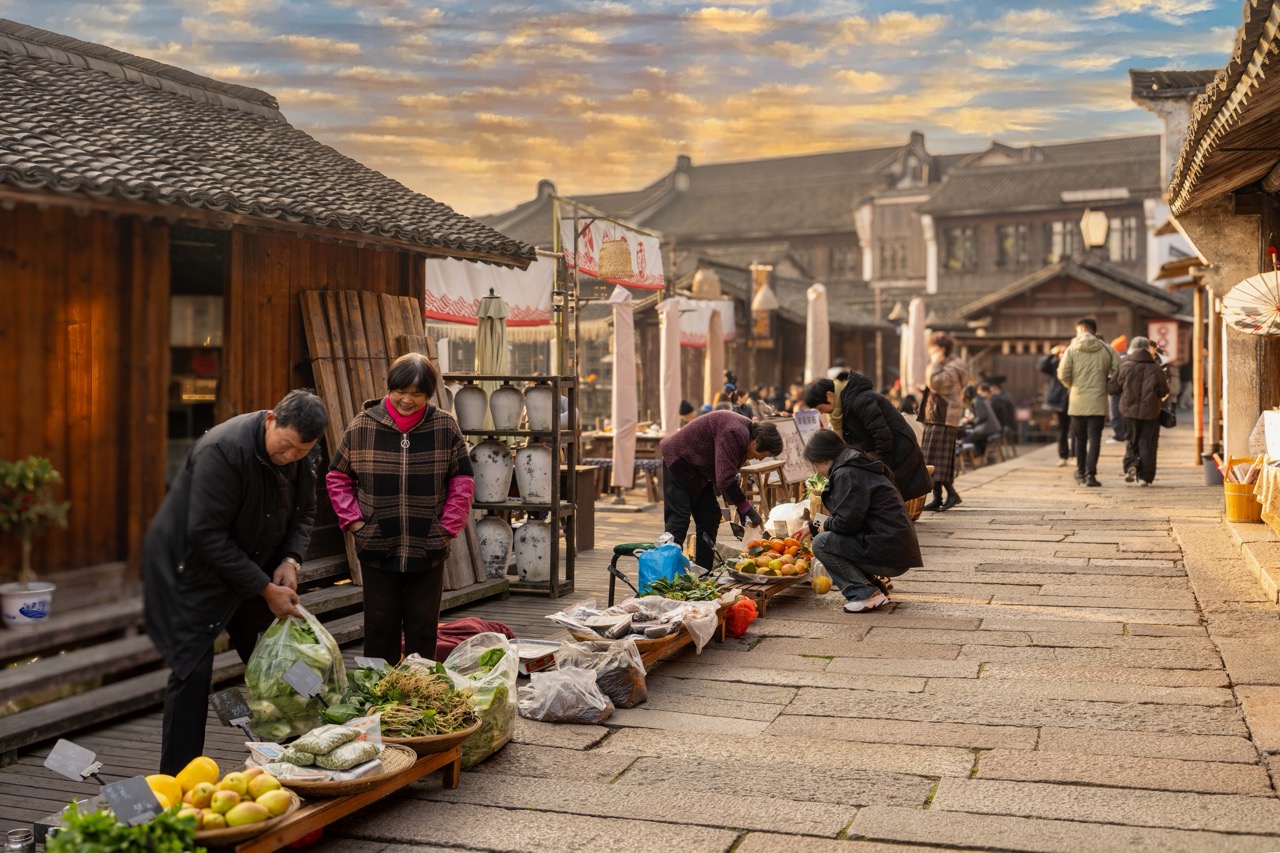 Local vendors selling fresh fruits and greens on stone paved ancient lane.