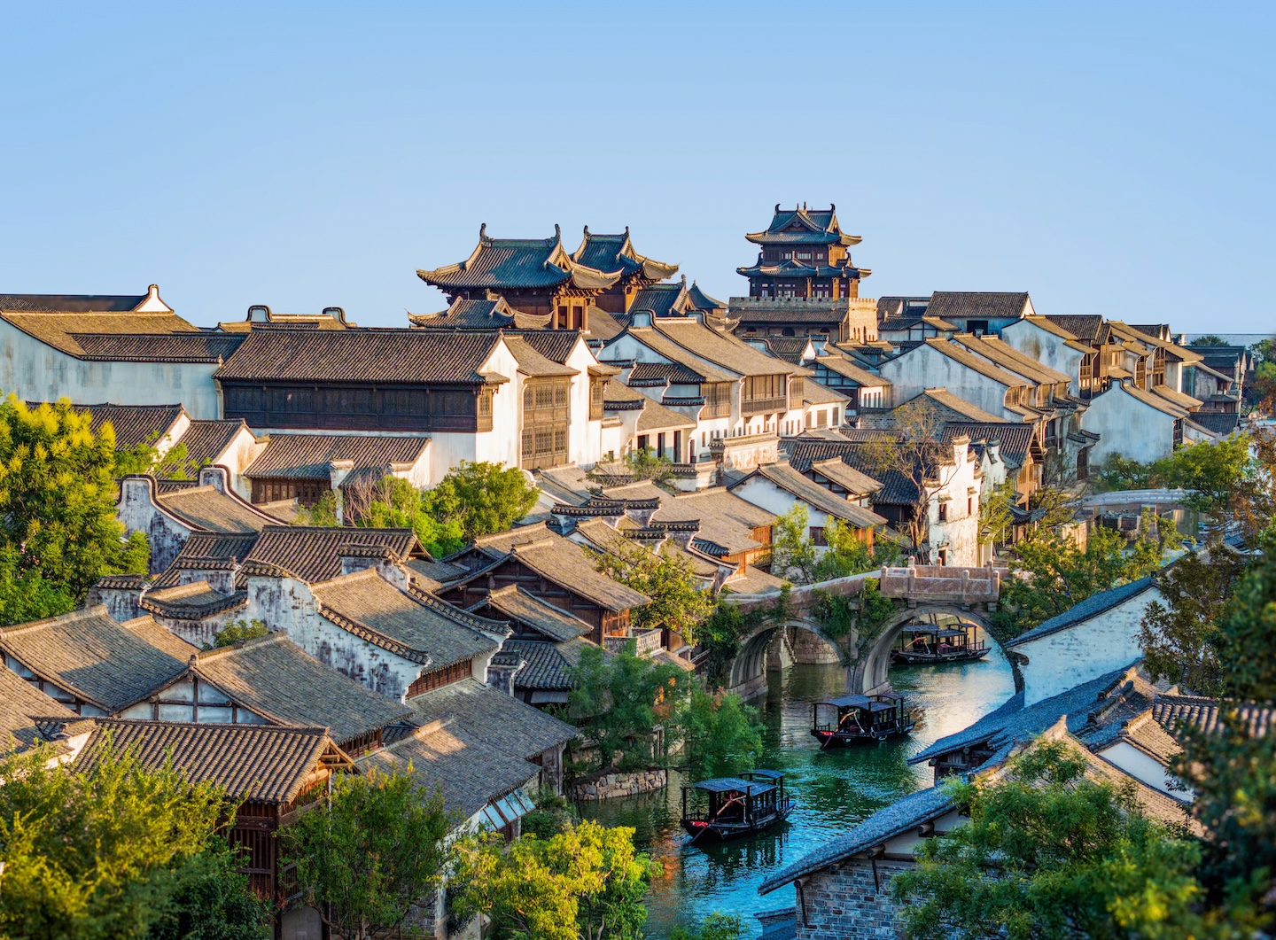 Panoramic view of the Yanguan scenic area, with ancient buildings of varying heights scattered along the river.